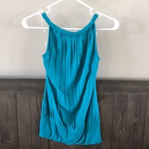 Blue-green tank with strappy back.